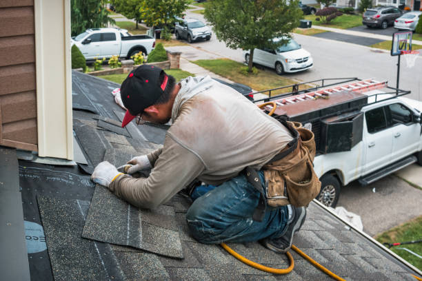 Professional Storm Damage Roof Repair technician working in New Knoxville, OH